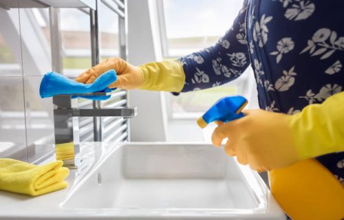 Cleaning sink and faucet with antibacterial detergent, coronavirus prevention Cleaning sink and faucet with antibacterial detergent, coronavirus prevention